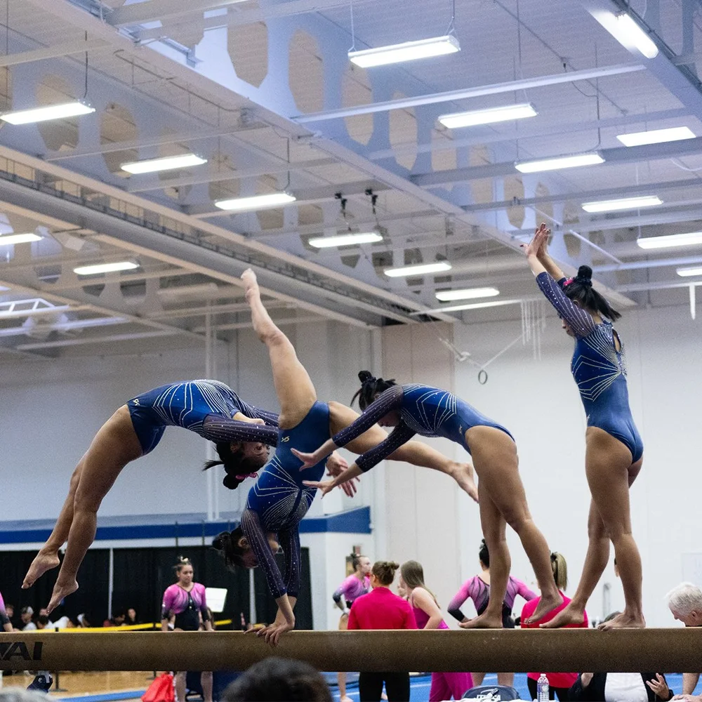 Multi-exposure edit of an Ithaca College gymnast on balance beam.